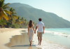 Voyage de noces : quand partir pour lune de miel parfait ? Jeune couple marié marche sur une plage tropicale ensoleillée