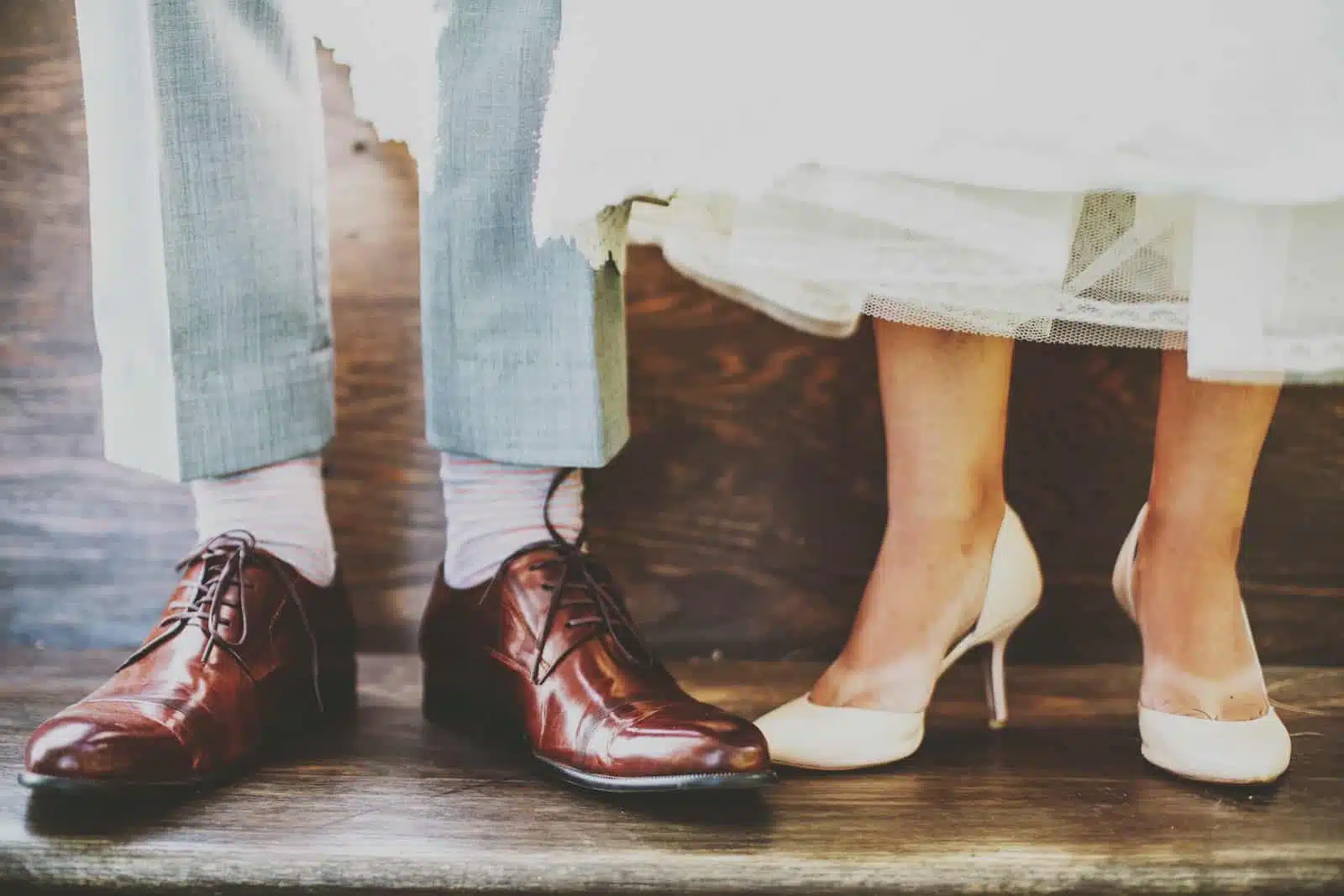 man and woman standing on wooden platform